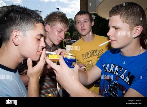 group of teenage boys smoking Stock Photo - Alamy