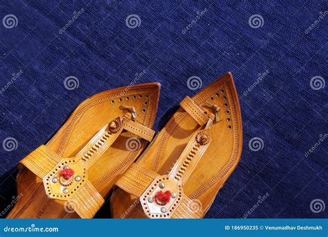 Maharashtrian Traditional Kolhapuri Chappal On Blue Background Stock