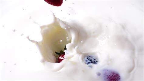 slow-motion milk dropping splashing making beautiful Stock Footage ...