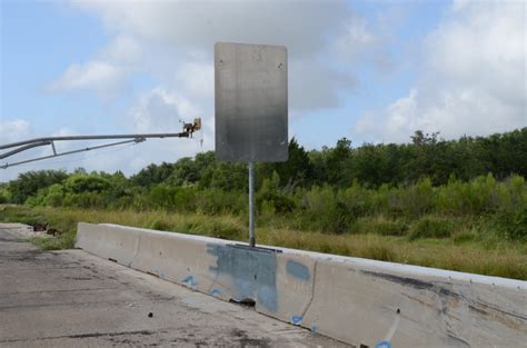 Sign on Concrete Median Barrier - Roadside Safety Pooled Fund