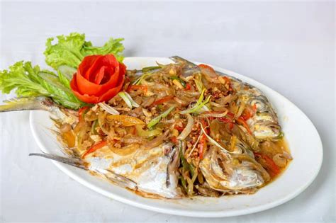 Steamed Pompano Or Kuwe Fish With Sweet And Spicy Sauce Stock Photo