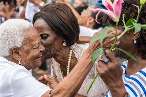 Faithful Catholics Embrace Each Other During The Corpus Christ Ceremony