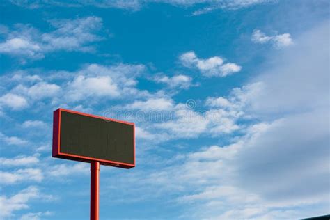 Large Advertising Banner Over Blue Sky with Clouds, with the Center Cut To Place Your ...