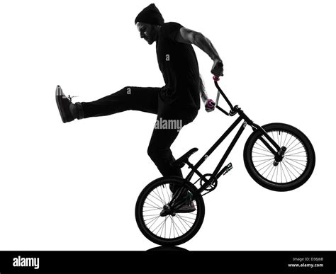 One Man Exercising Bmx Acrobatic Figure In Silhouette Studio Isolated