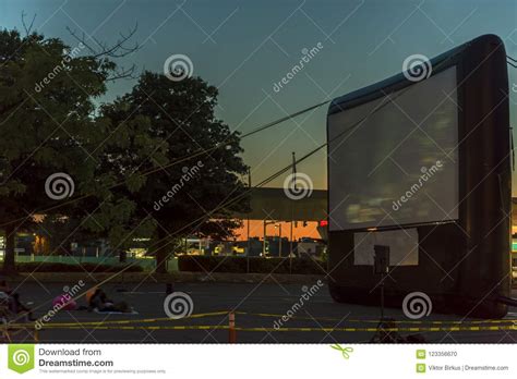 Watching Movies In The Open Air In A Car Park In The City In The Stock