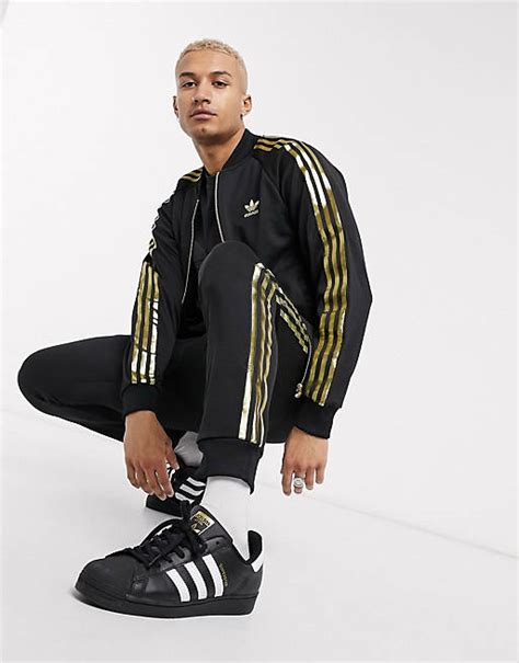 Adidas Originals Superstar Tracksuit In Black And Gold Asos