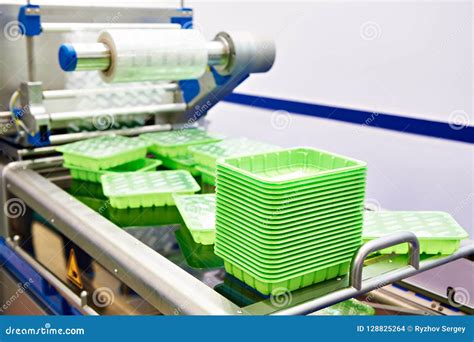 Machine Packing Plastic Food Containers Stock Photo - Image of ...