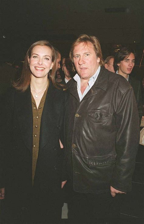 Photo Carole Bouquet et Gérard Depardieu au défilé Chanel en 2001 à