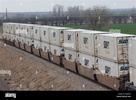 Double Stacked Swift Intermodal Containers On Bnsf Freight Train At