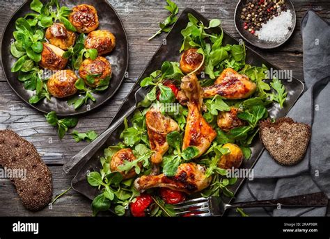 Spicy Roasted Chicken Legs With Potatoes And Salad Top View Food In