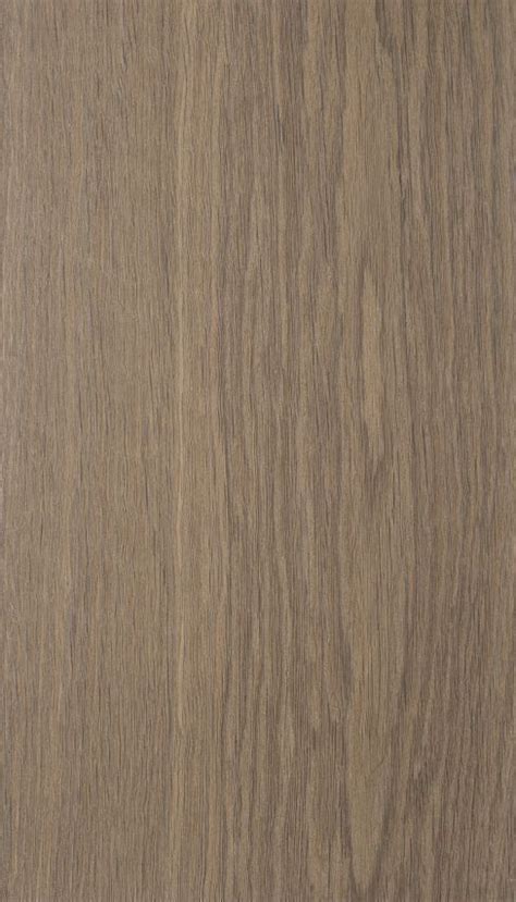 A Close Up View Of The Wood Grains On An Oak Flooring Paneled In Light