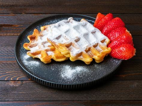 Premium Photo Freshly Baked Belgian Viennese Waffles Sprinkled With