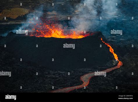 Volcano Eruption In Iceland A Fountain Of Glowing Red Lava Rising