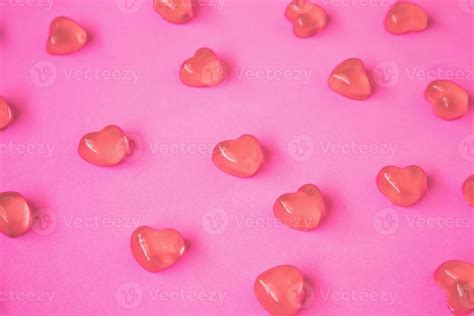 Valentines day background with heart shape candy on pink background ...