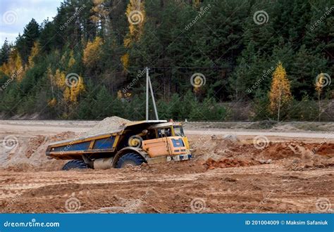 Earth Mover Loading Dumper Truck With Sand In Quarry Excavator Loading