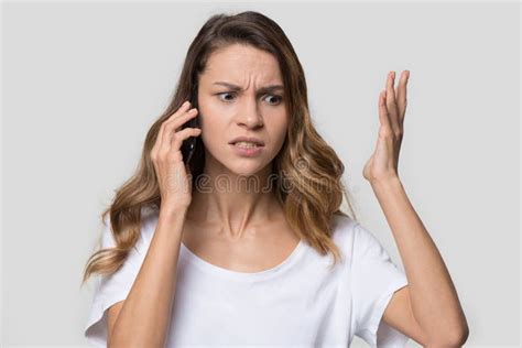 Annoyed Angry Woman Mad About Stuck Phone Isolated On Background Stock