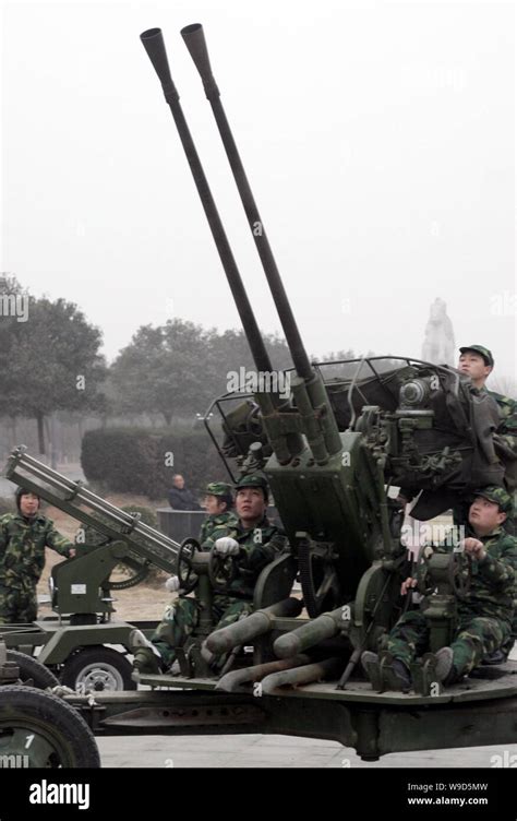 Local Chinese Meteorological Department Workers Prepare An Anti