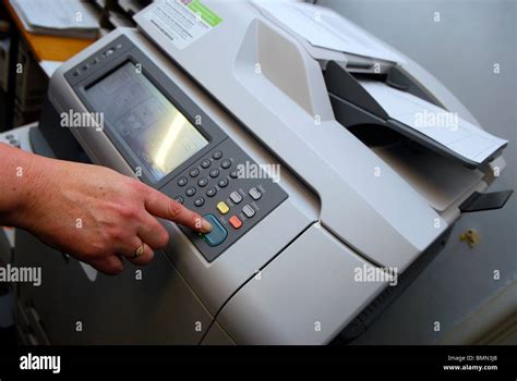 Office Worker Using Copying Machine Wirral Uk Stock Photo Alamy