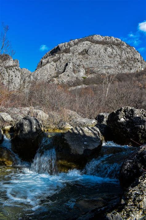 Small Alpine Waterfall in Autumn · Free Stock Photo