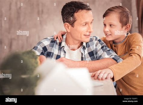 Blonde Haired Son Wearing Yellow Shirt Hugging His Father Stock Photo Alamy