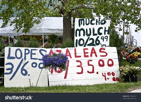 Roadside Produce Stand With Huge Home-Made Signs Set Outside To Entice ...