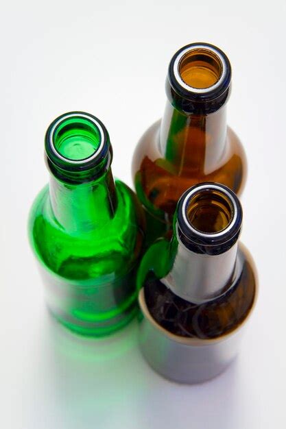 Premium Photo High Angle View Of Bottles On Table Against White Background