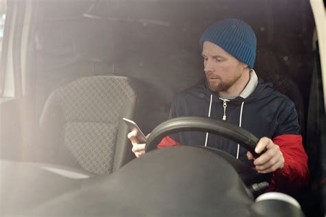 Man in Blue Knit Cap Driving Car · Free Stock Photo