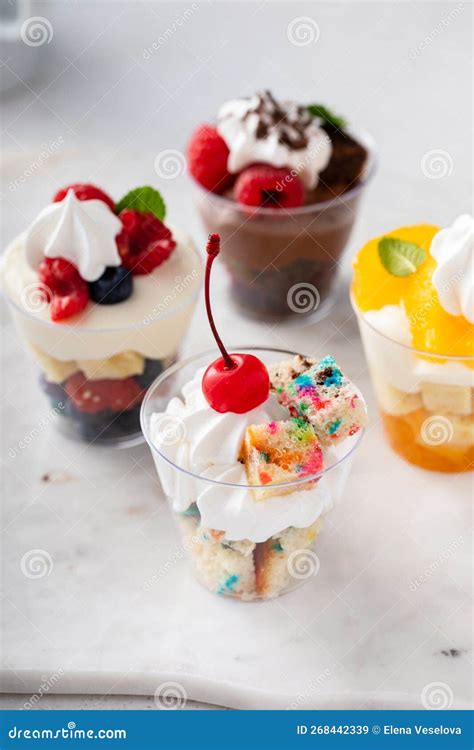 Variety of Small Desserts in Cups, Chocolate, Berry and Orange Stock ...