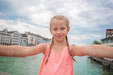 Adorable little girl taking selfie outdoors in Zurich, Switzerland ...