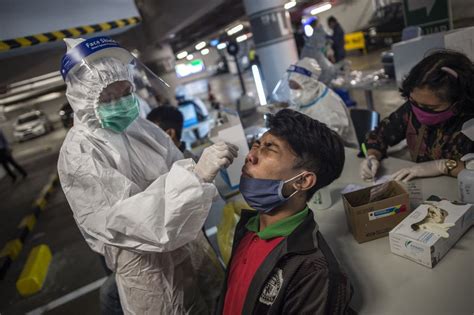 indonesias virus cases   million  hospitals fill