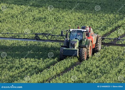 Agriculture A Farmer Spraying Fertilizer On His Crops Editorial Image