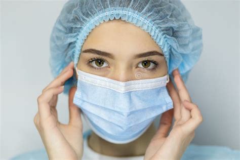 Close Up Headshot Portrait Of Woman In Protective Medical Mask Stock