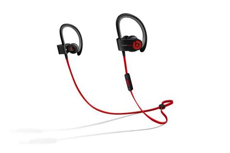 the beatsport sport headphones are red and black, with one earphone ...