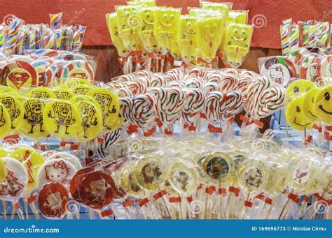 Many Colored Lollipops Round Or Squared Packed In Transparent Bags