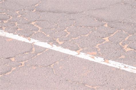 Premium Photo | Cracked asphalt road