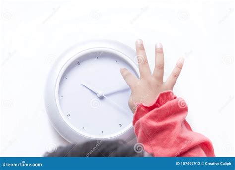 Kid`s Fingers Pointing Towards The Digital Clock Stock Photo Image