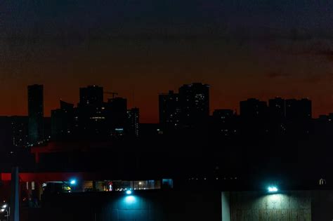 Premium Photo | Skyline at night with building and lights on sunset ...