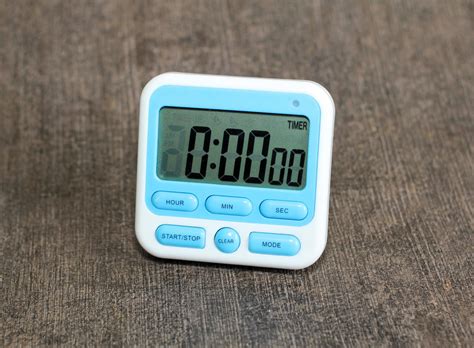 Digital Kitchen timer white color and light blue color on dark ...