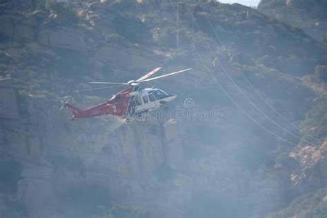 A Lafd Augustawestland 139 Helicopter Makes A Water Drop On A Brush