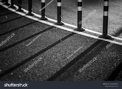 running track black white background shadows stock photo
