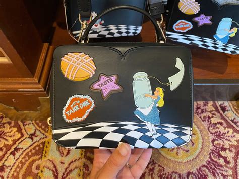 PHOTOS New Kate Spade Alice In Wonderland Collection Debuts At Walt