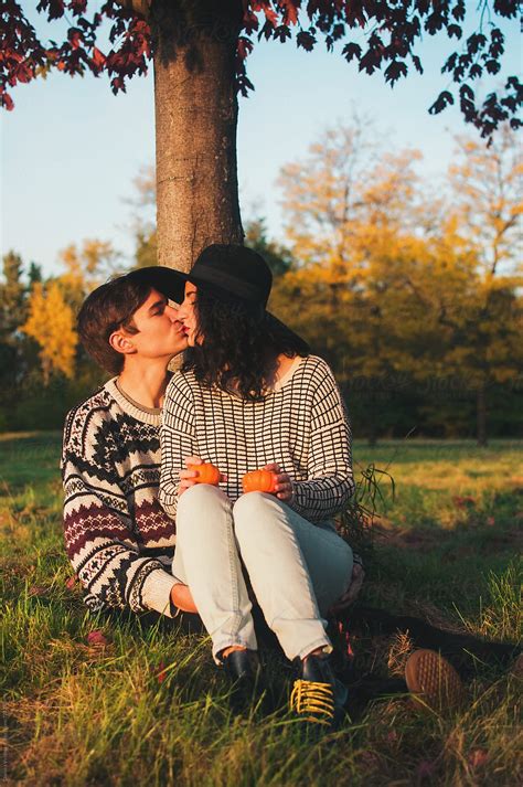 "A Young Couple Kissing Under A Tree In The Fall" by Stocksy ...