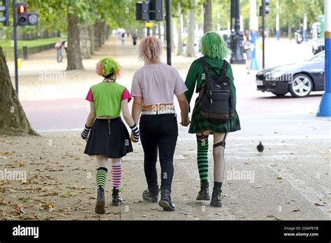 London, England, UK. Young people with colourful clothes and hair in ...