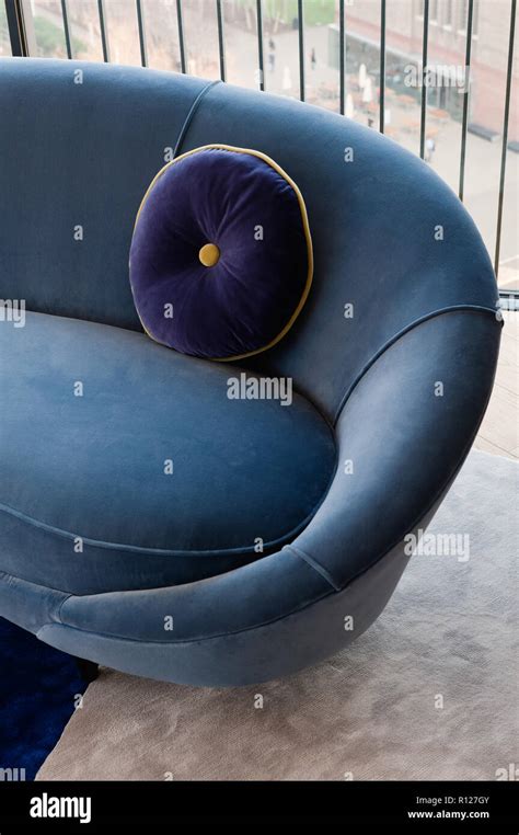 Blue cushion and sofa Stock Photo - Alamy