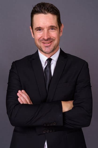 Premium Photo Portrait Of Man Wearing Mask Against Gray Background