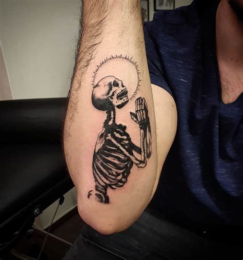 Praying Skeleton Tattoo Designs