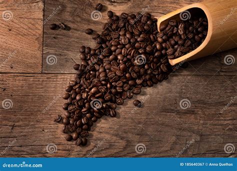 Top View Roasted Coffee Bean On Wooden Table For Background Stock Image