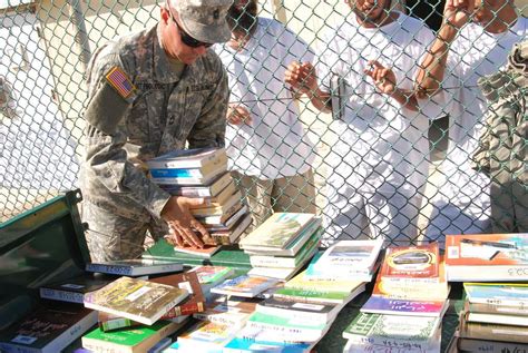 A Joint Task Force Guantanamo Trooper Displays Reading Nara Dvids