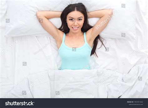 Young Woman On Bed Top View Stock Photo 1053351662 | Shutterstock