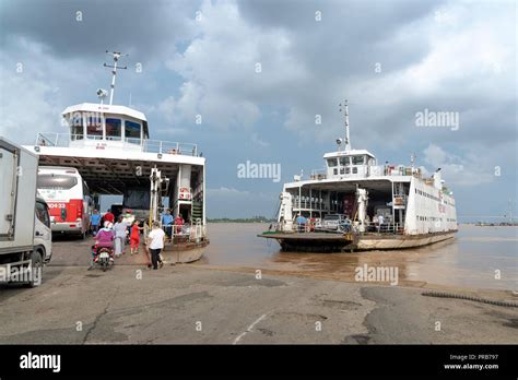 Big ferry transporting cars and passengers across the Hau Giang river ...